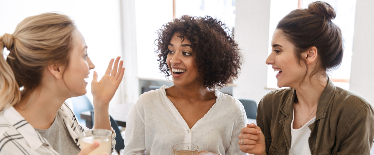a group of diverse young women laughing