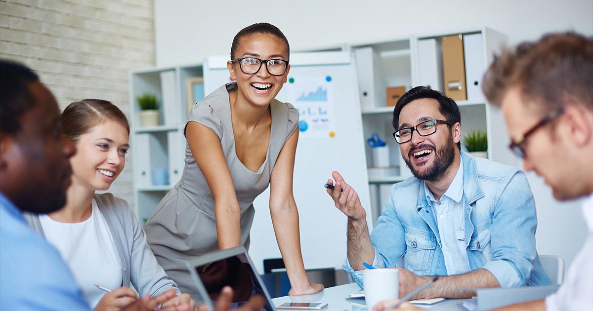 a group of your professionals collaborating and laughing